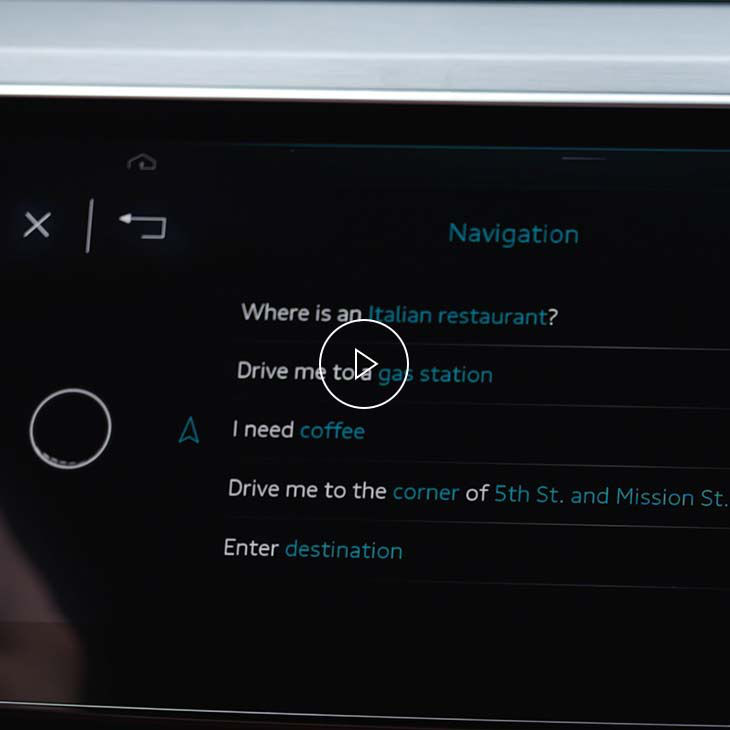  Close-up photo of the Navigation intelligent search screen on the Audi MMI display inside an Audi vehicle.