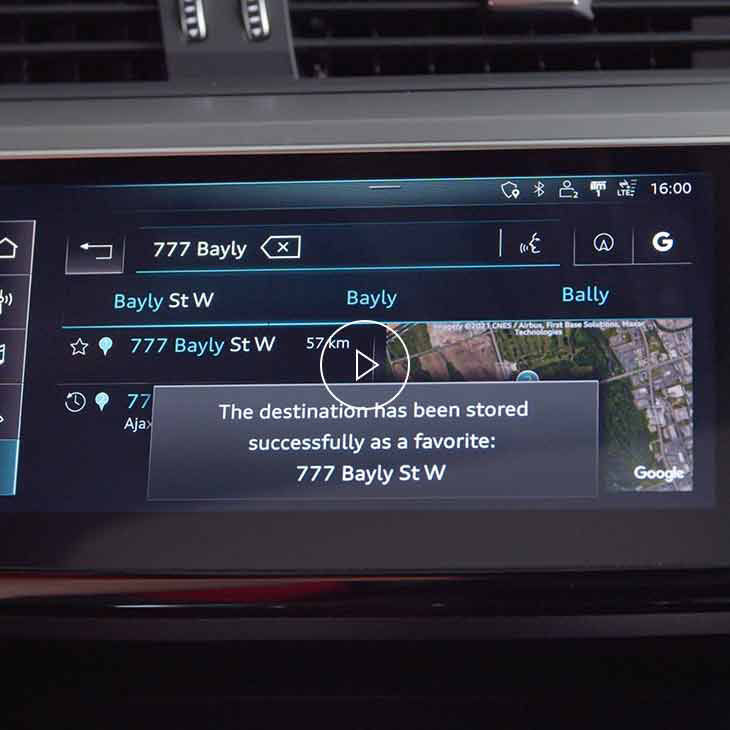 Close-up photo of the Navigation favourites screen on the Audi MMI display inside an Audi vehicle.