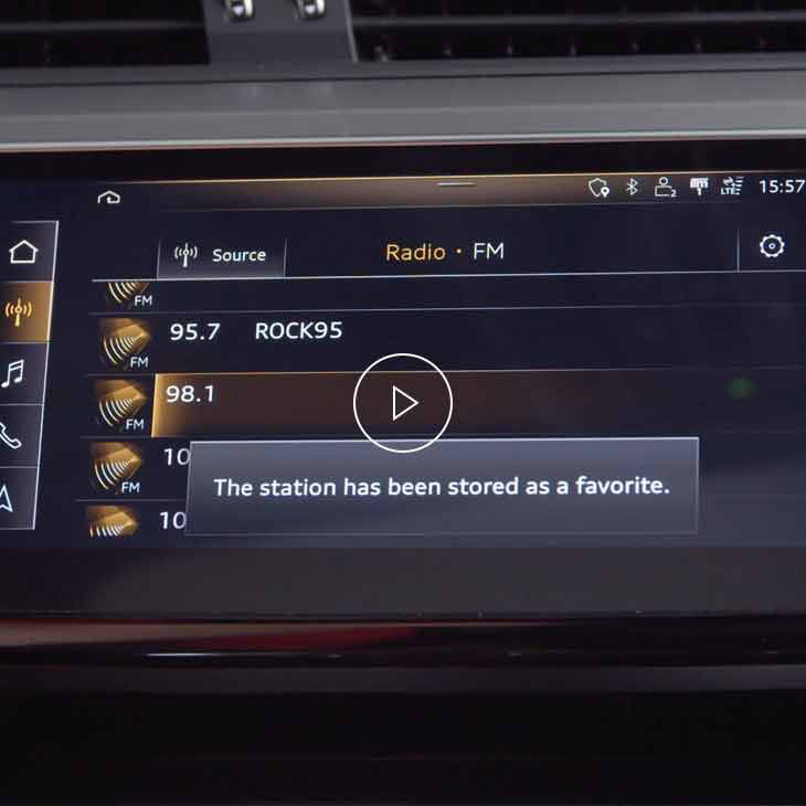 Close-up photo of the radio favourites screen on the Audi MMI display inside an Audi vehicle.