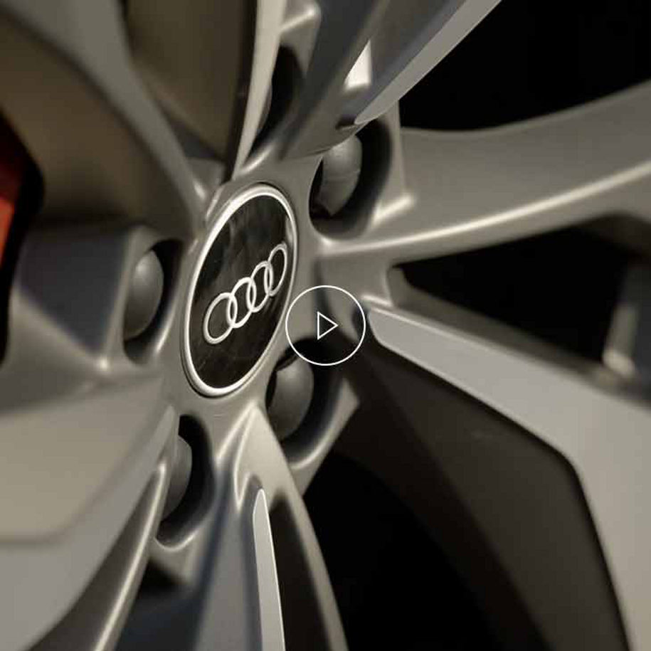 Close-up photo of the wheel of an Audi vehicle. 