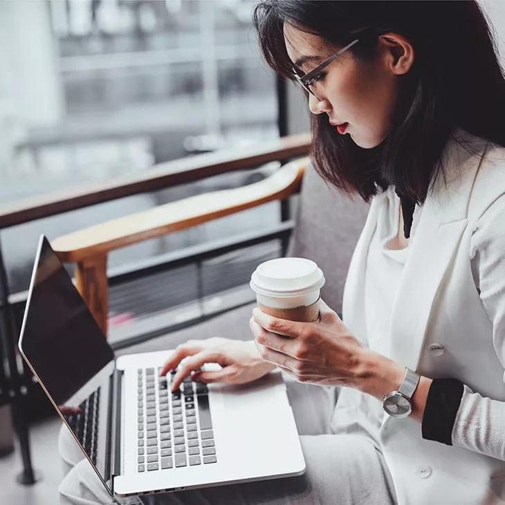 View of woman on her electronic device.