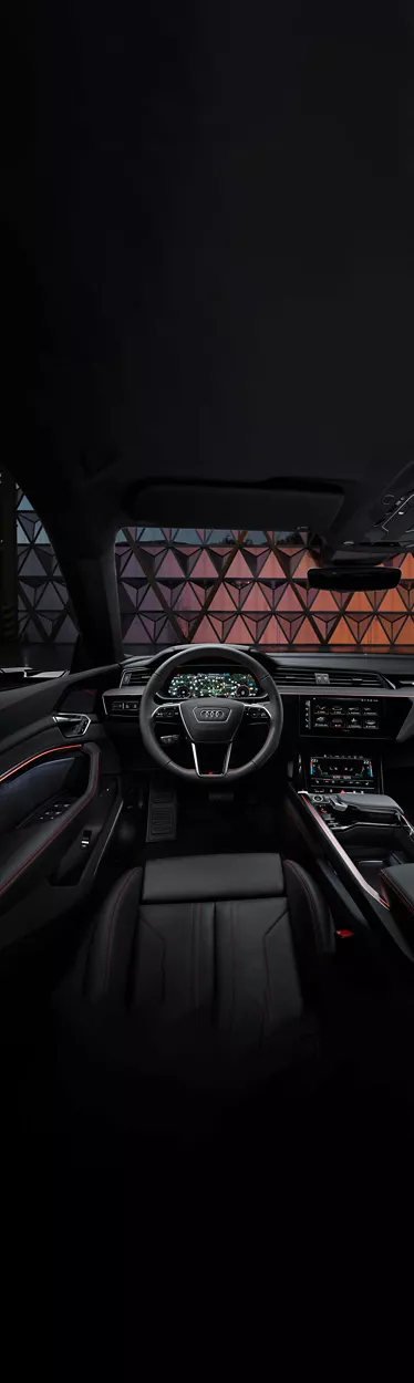 Interior shot of the cockpit and dashboard of an Audi. 