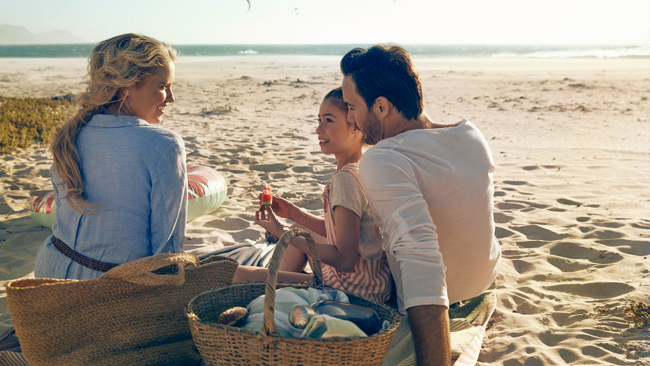 View of a family having a picnic on the beach.