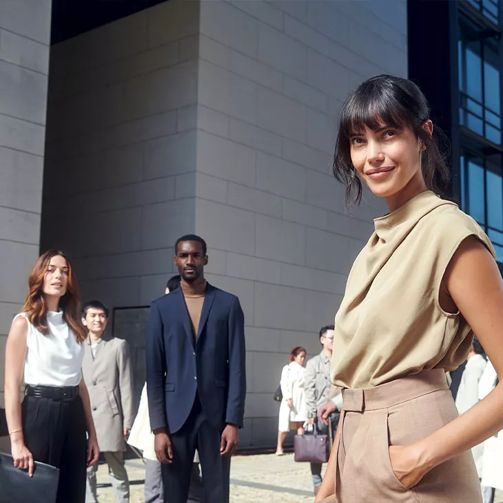 A group of people gathered outside a building. 