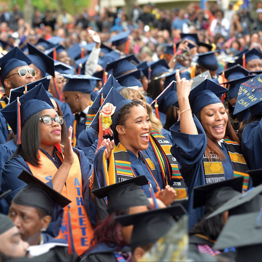A group of graduates celebrating at a Lincoln University graduation.