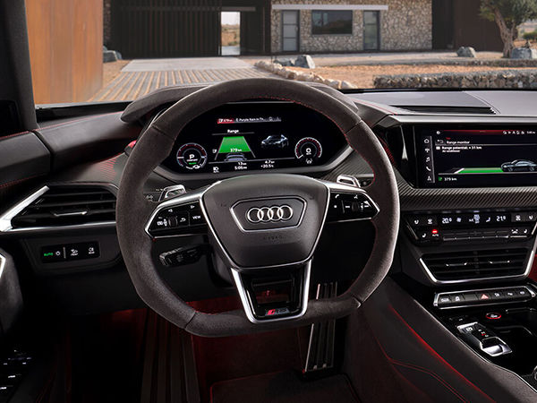 Close up on steering wheel and virtual cockpit in an Audi Vehicle.