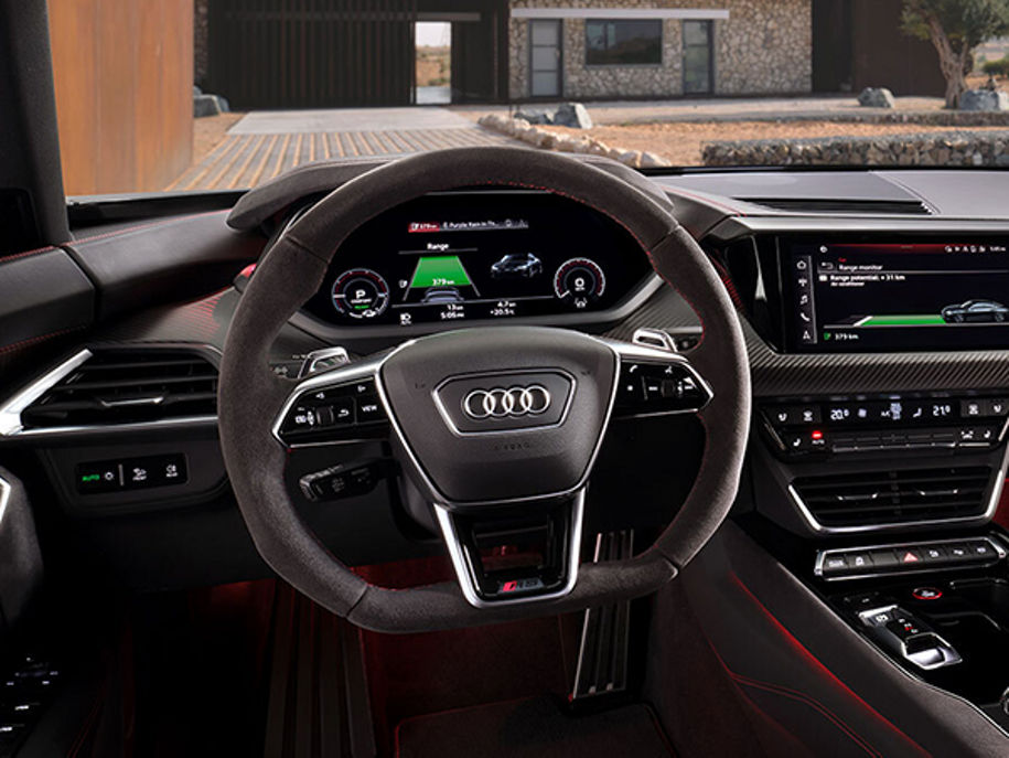 Close up on steering wheel and virtual cockpit in an Audi Vehicle.