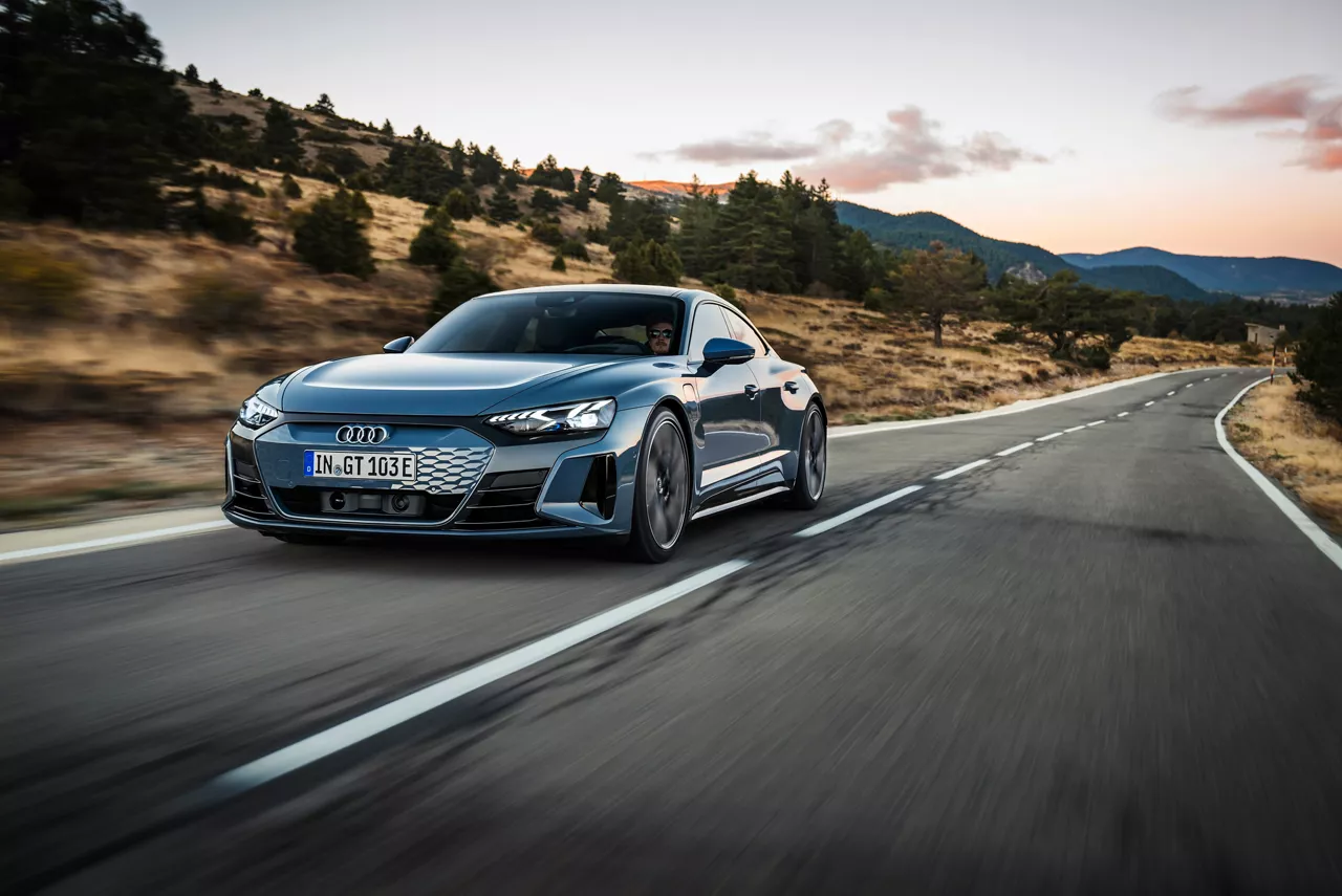 Three-quarter front view of an Audi e-tron GT in motion.