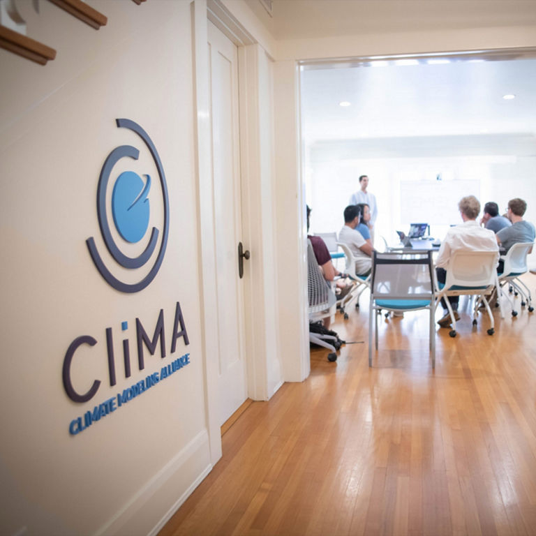 A group of people gathered at CliMA.
