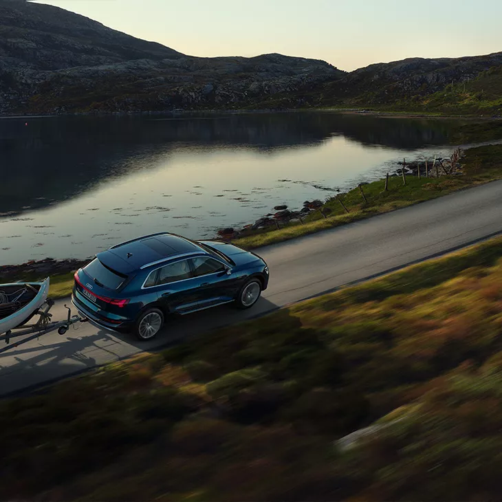 The Audi e-tron® towing a trailer. 