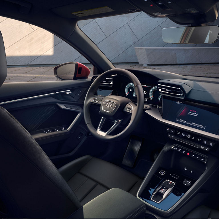 Interior view of the dashboard and front seat of the Audi A3.