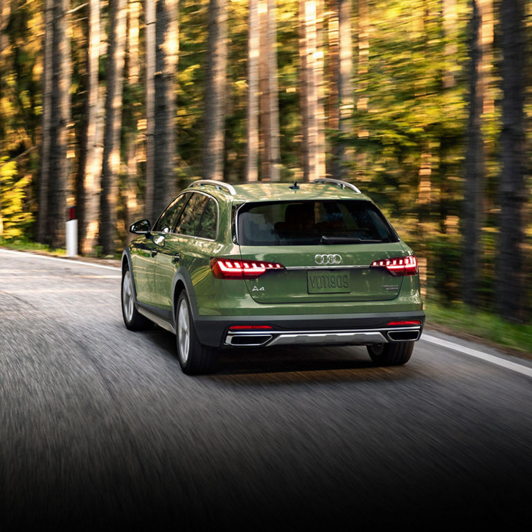 Three-quarter back view of the Audi A4 allroad® in motion.