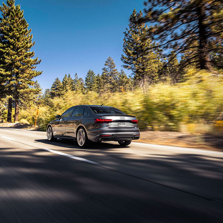 Side view of the Audi A4 Sedan accelerating.