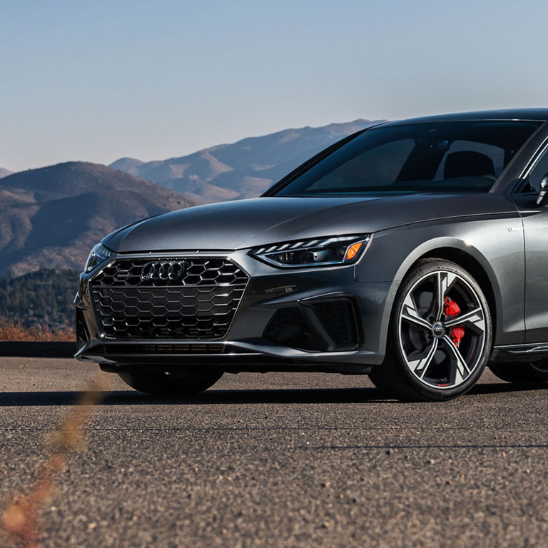 Three-quarter front profile of the Audi A4 Sedan.