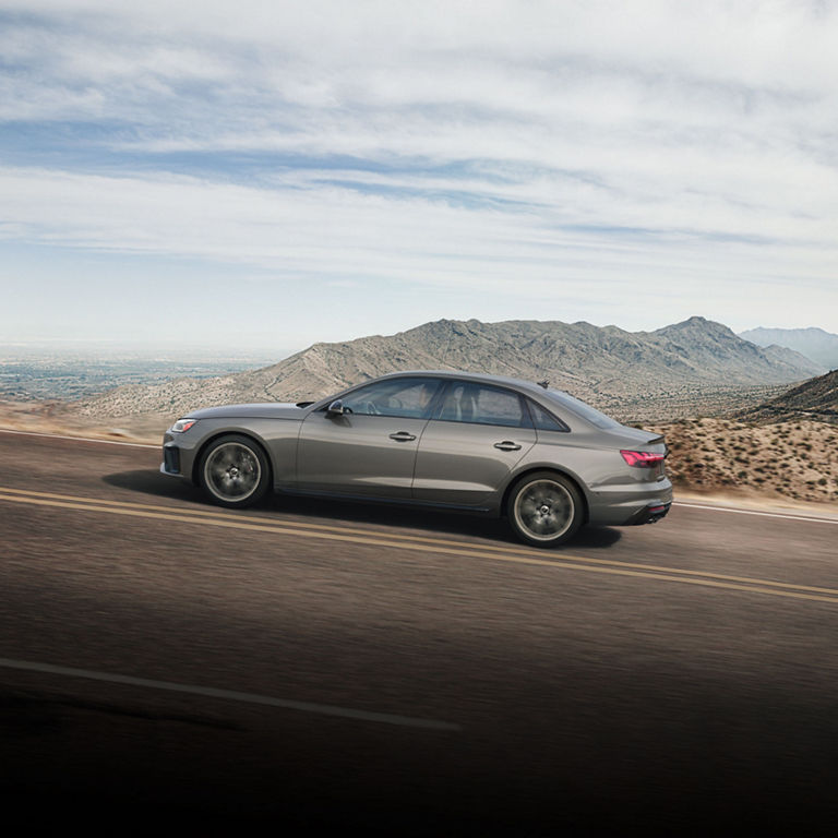 Side profile of the Audi S4 Sedan accelerating. 