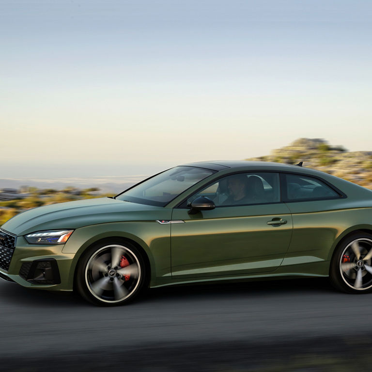 Side profile of the Audi A5 Coupe accelerating.