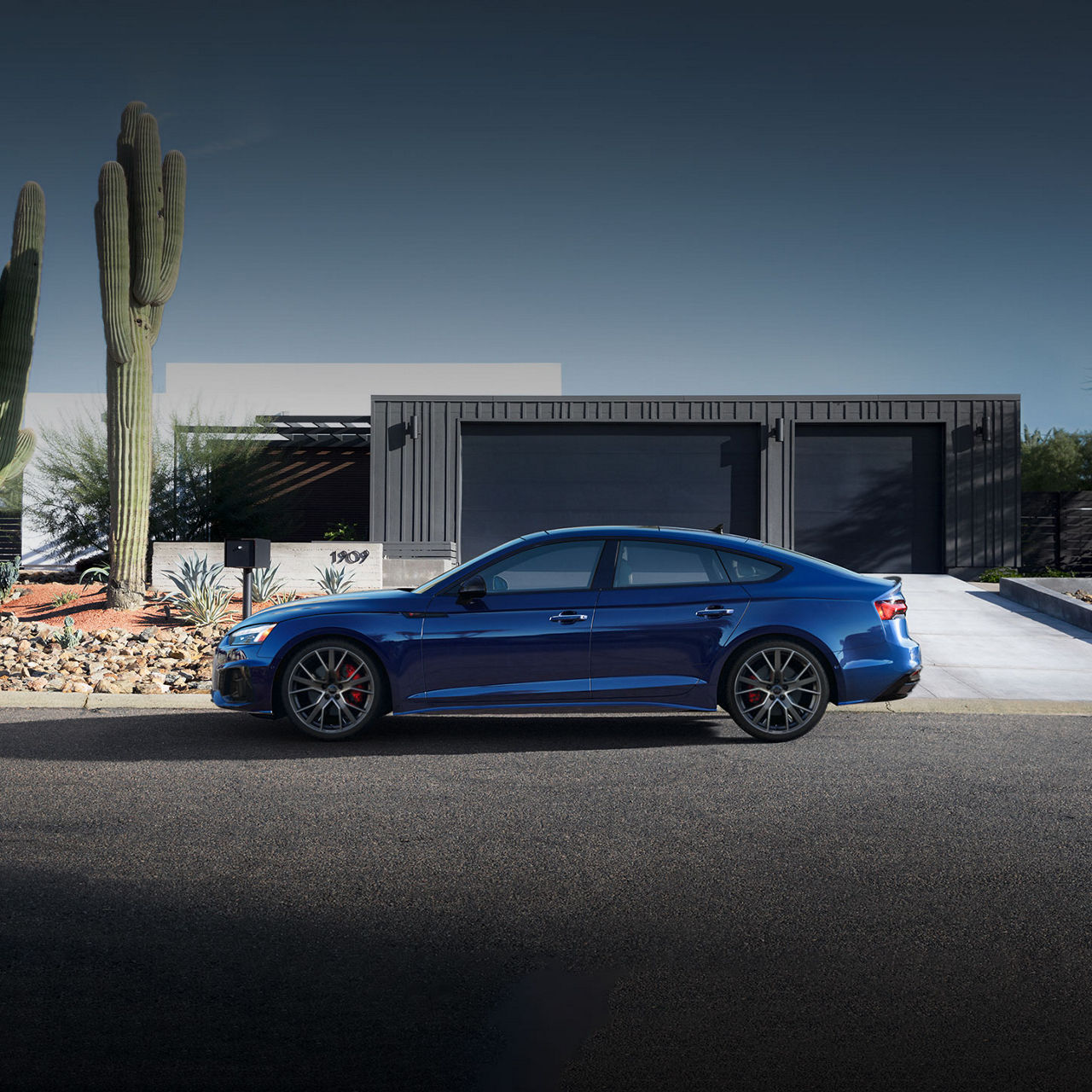 Three-quarter rear profile of the Audi A5 Sportback parked.
