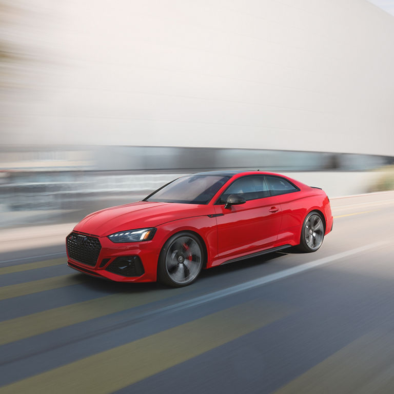 Three-quarter front profile of the Audi RS5 Coupe. 