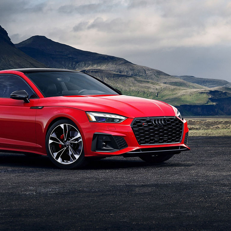 Three-quarter side profile of the Audi S5 Coupe.