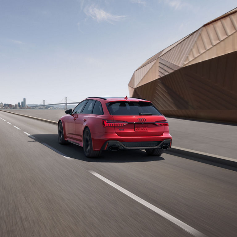 Rear profile of the Audi RS 6 Avant accelerating.