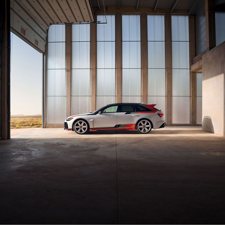 Side view of the Audi RS 6 Avant GT parked in a garage.