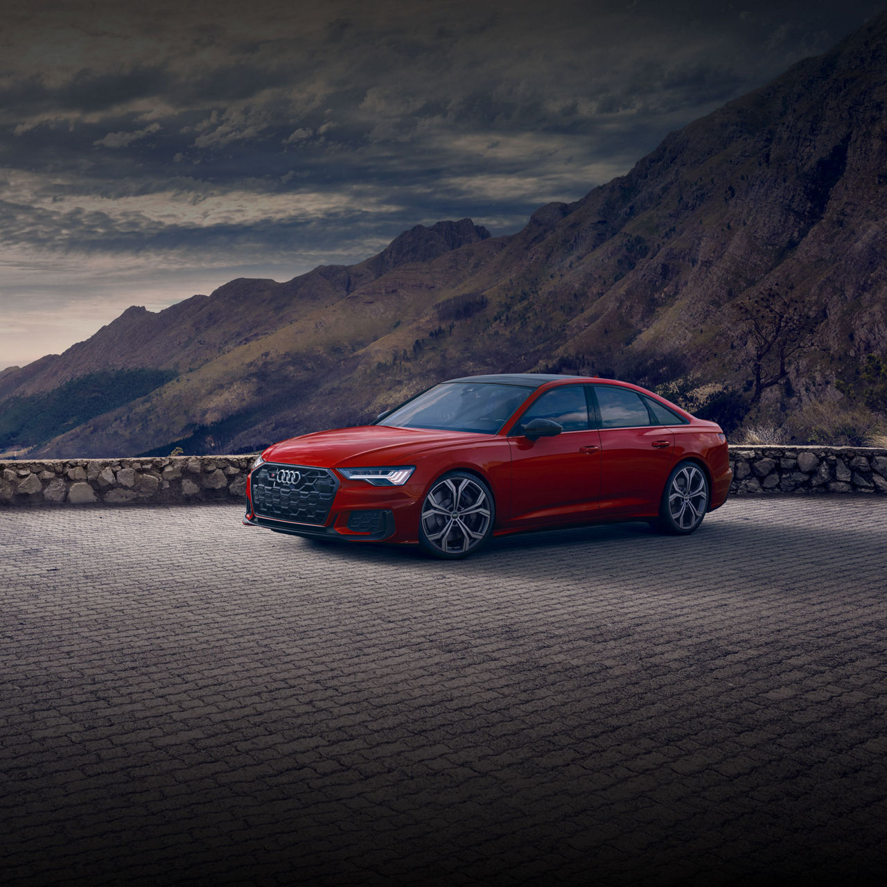 Three-quarter front profile of the Audi S6 Sedan.