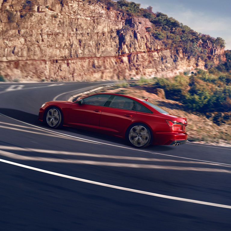 Side view of the Audi S6 Sedan in motion. 