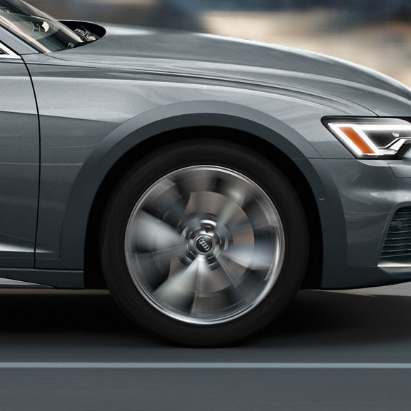 Close-up of the wheel on the Audi A6 allroad® accelerating.