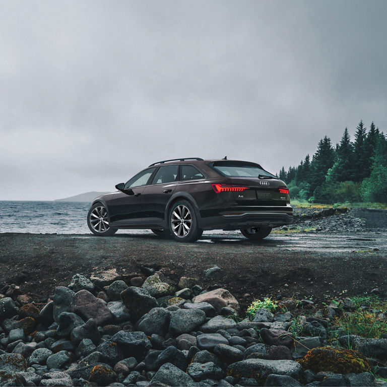 Three-quarter front view of the Audi A6 allroad accelerating.