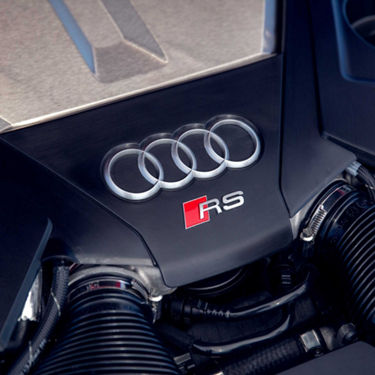  Close-up of Audi rings and RS badging on an Audi Sport engine. 