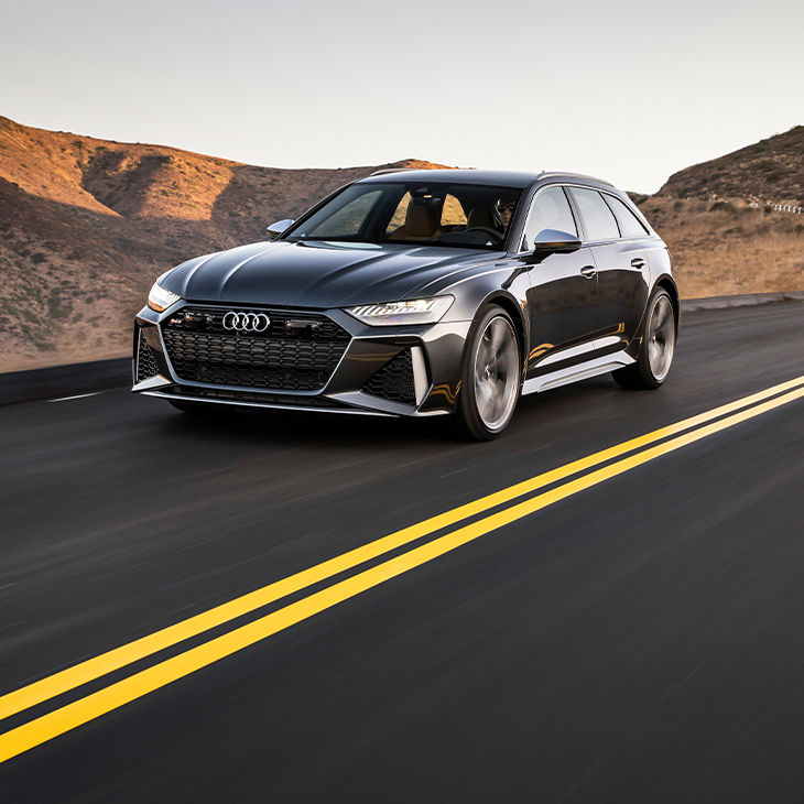 Three-quarter front view of the Audi RS 6 Avant accelerating.