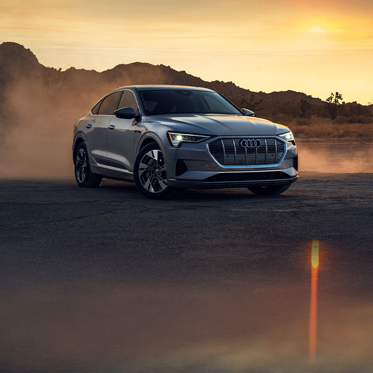 Three-quarter front view of the Audi e-tron® Sportback parked.