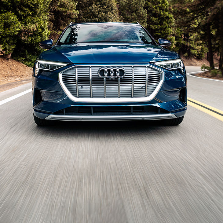 Front profile of the Audi e-tron® accelerating.