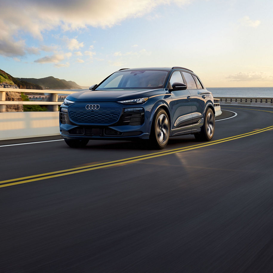 Three-quarter front view of the Audi Q6 e-tron.