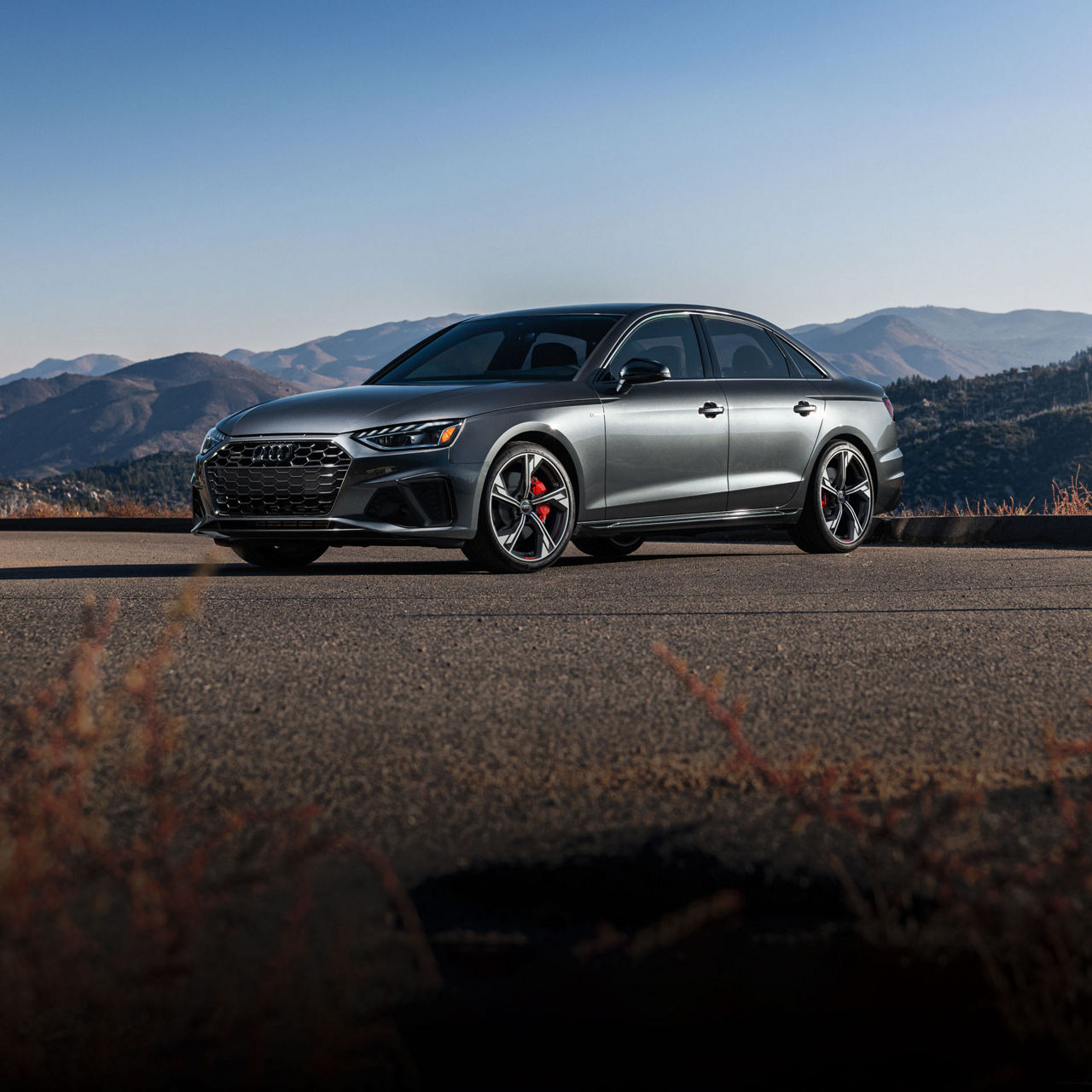 Three-quarter front view of the Audi A4 Sedan parked.