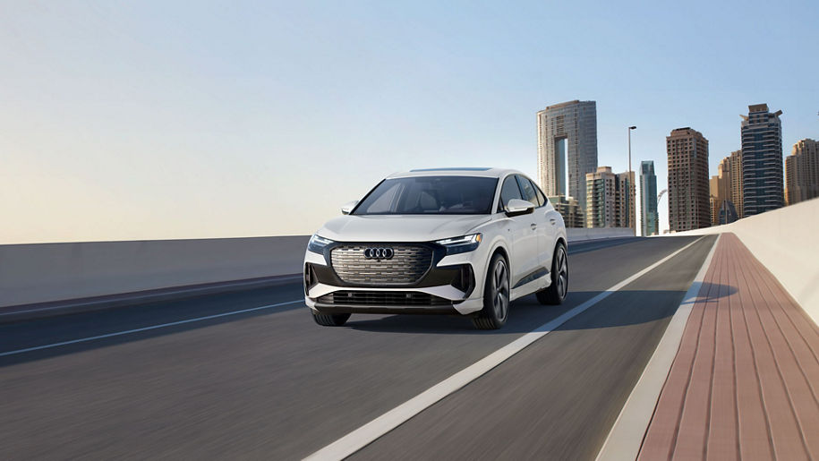 Front profile of the Audi Q4 Sportback e-tron accelerating.