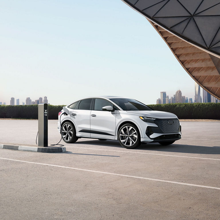 Side profile of the Audi Q4 Sportback e-tron charging.