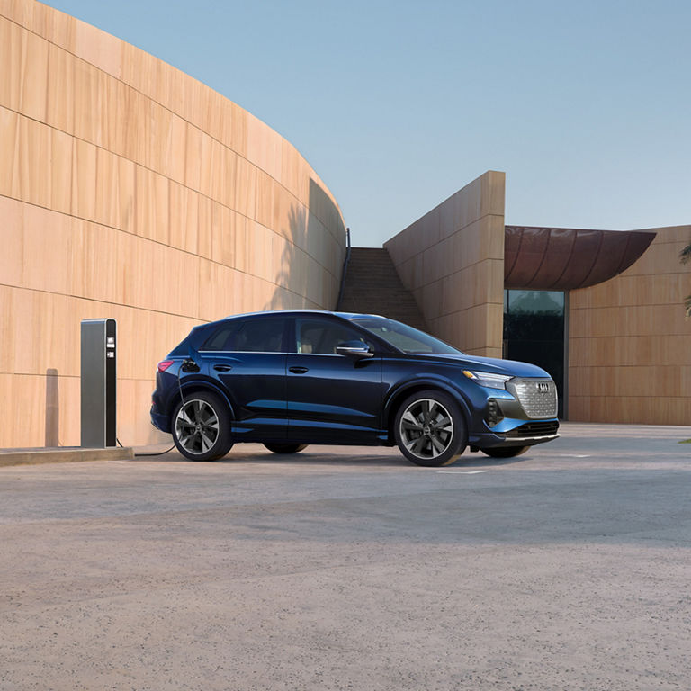 Side profile of the Audi Q4 e-tron® charging.
