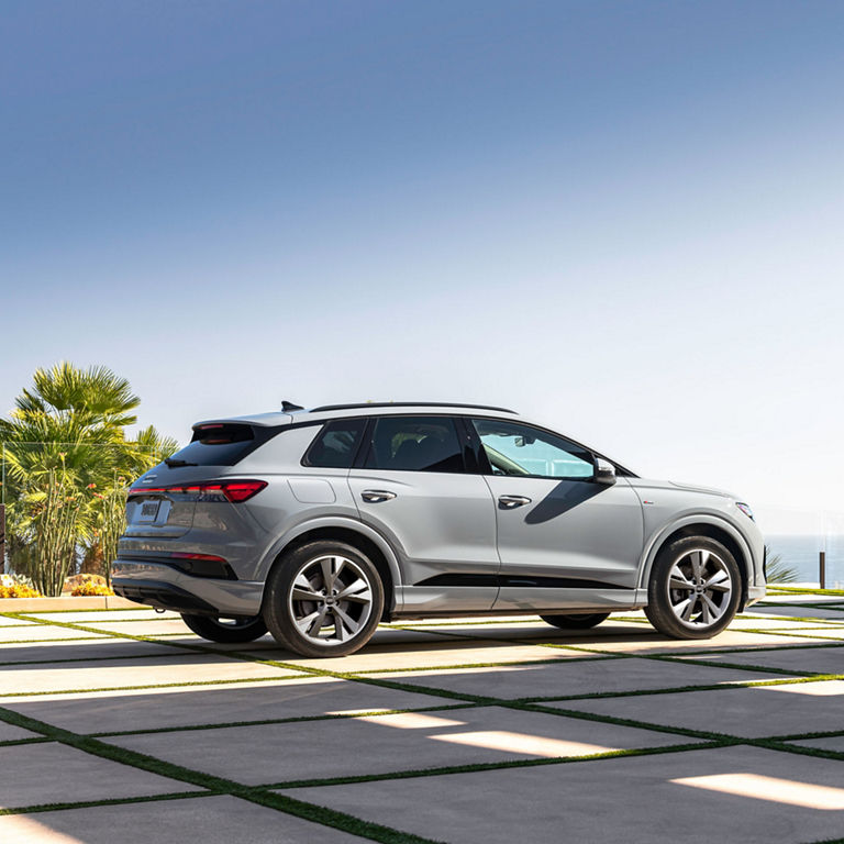 Three-quarter rear profile of the Q4 e-tron. 