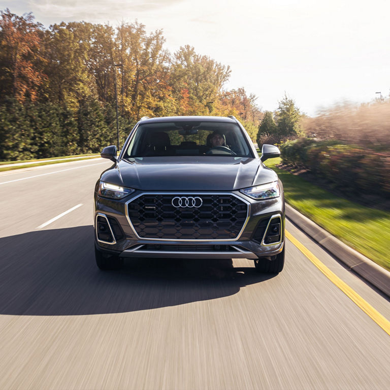 Front view of the Audi Q5 PHEV accelerating. 