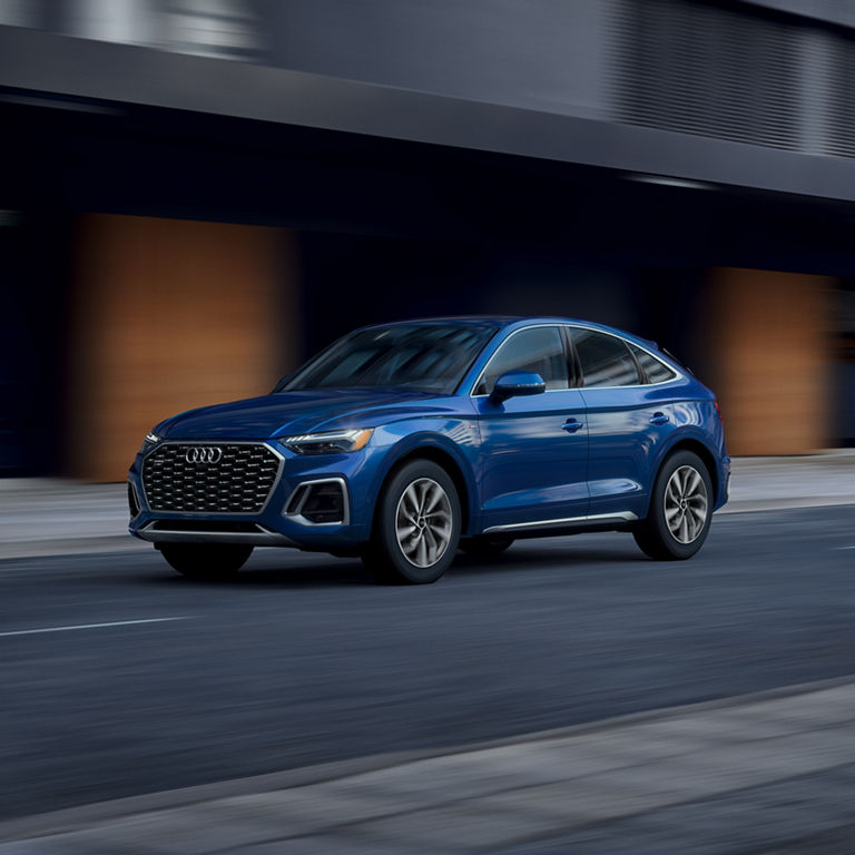 Three-quarter side view of the Audi Q5 Sportback accelerating.