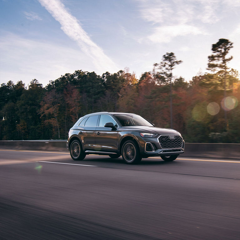 Side view of an Audi Q5 in motion. 