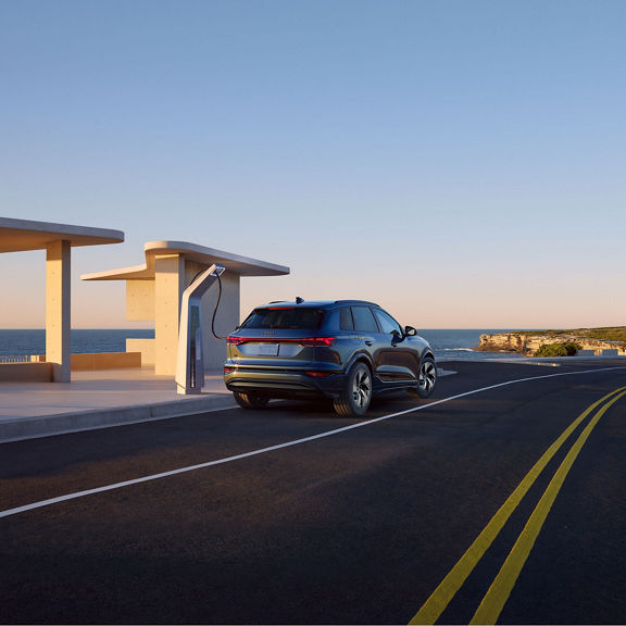 Rear view of the Audi Q6 e-tron charging.