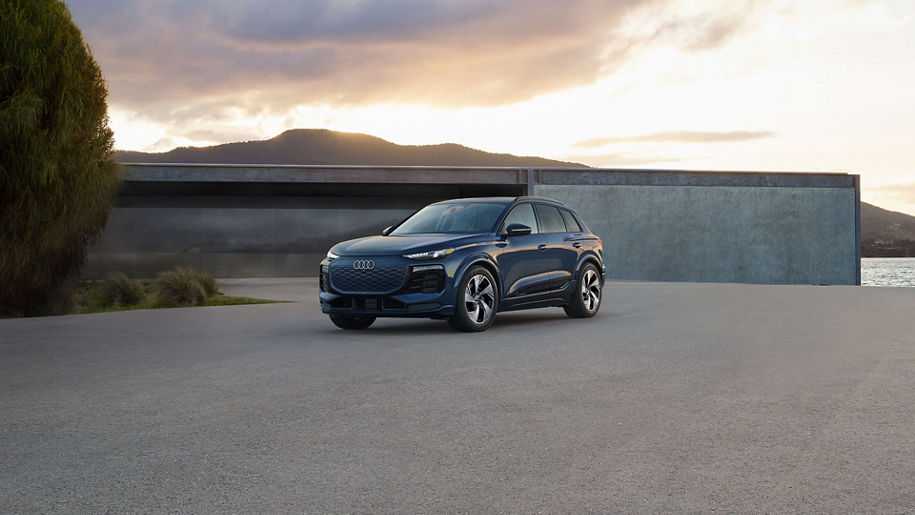 Three-quarter front view of the Audi Q6 e-tron.