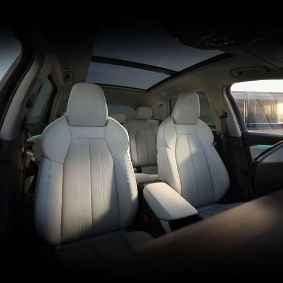 Interior view of the front seats in the Audi Q6 e-tron.