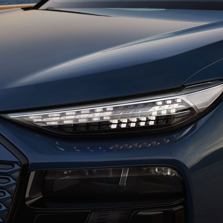 Close up on the front right headlight of the Audi Q6 e-tron.