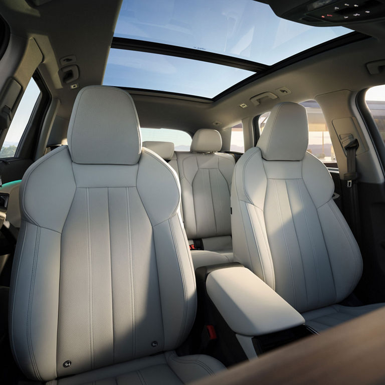 Interior view of the front seats in the Audi Q6 e-tron. 