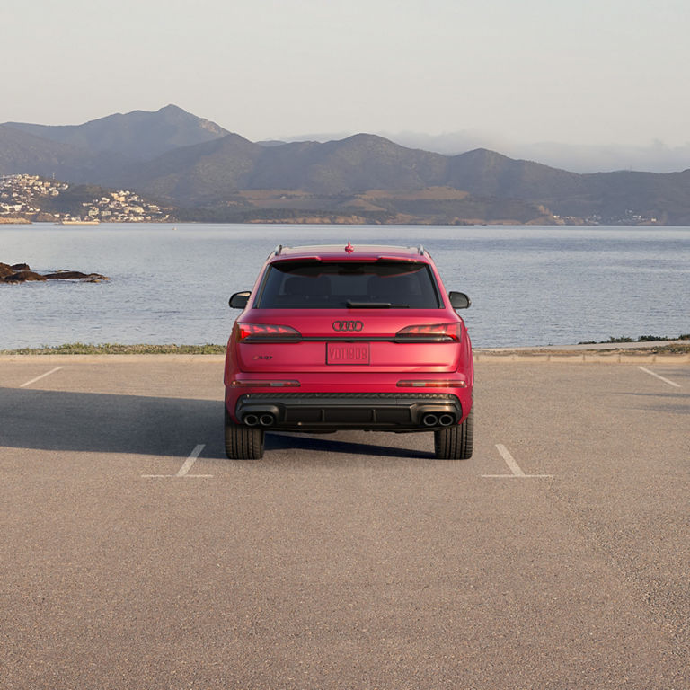 Rear view of a red Audi SQ7 parked. 