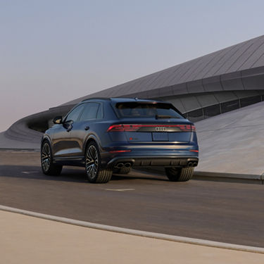 Rear view of the Audi SQ8 accelerating.
