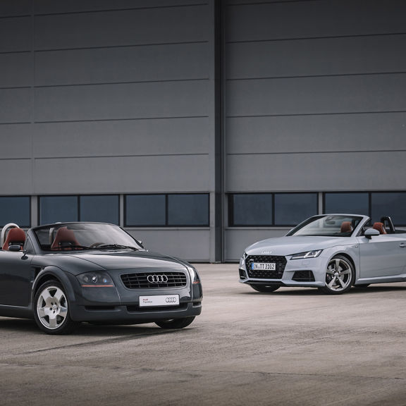 Two Audi TT Roadsters parked.